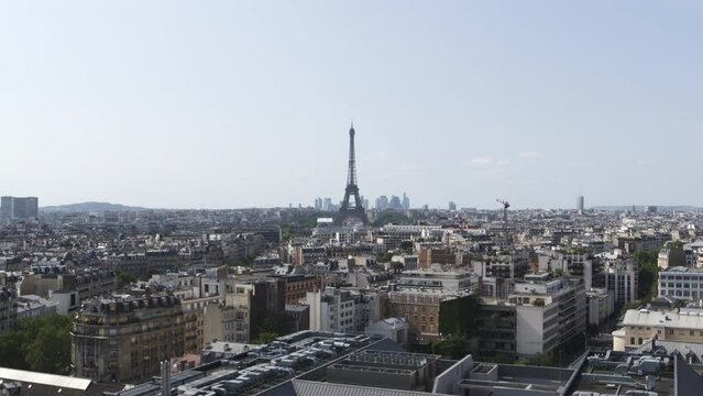 Elevation drone shot of Paris Eiffel Tower and its landscape
