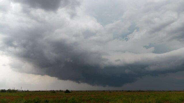 Rotating wall cloud associated with tornado-warned supercell.