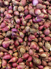 piles of fresh onions in the market
