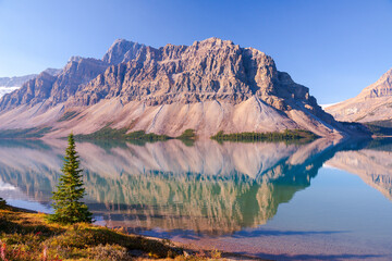 Beautiful picturesque morning lake surrounded by majestic rocky mountains. Bow Lake, Banff National...