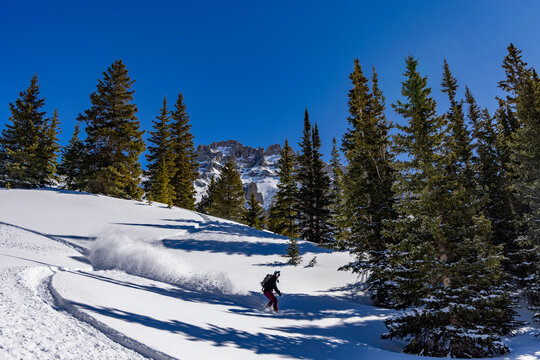 Splitboarding woman in the backcountry of Colorado
