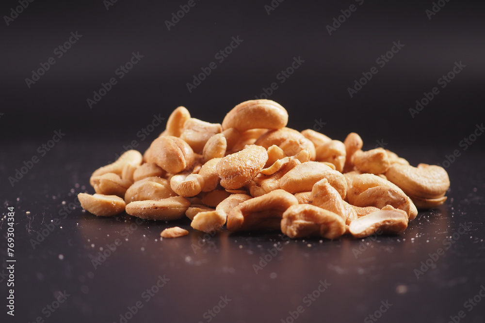 Wall mural cashew nuts on black color background  - Wall murals