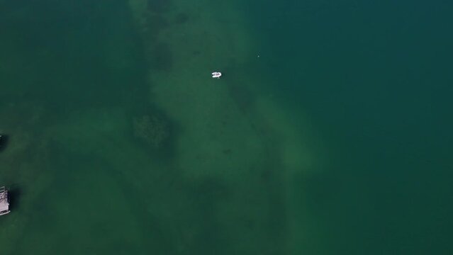 White boat in a beautiful green lake