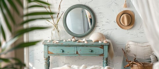 Vintage dressing table with mirror and shells against white loft-style bedroom wall