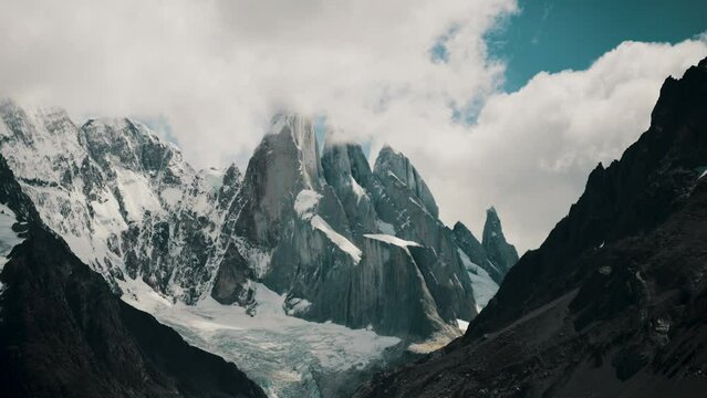 Cloudcapped Mountain Cerro Torre In Patagonia, Argentina In Summer. wide static shot