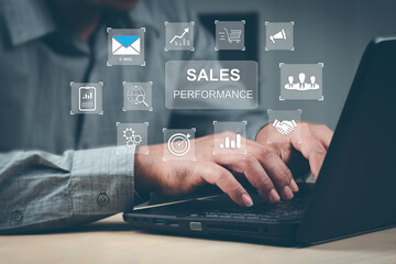 Sales performance management concept. Businessman use laptop to analyze data and sales performance....