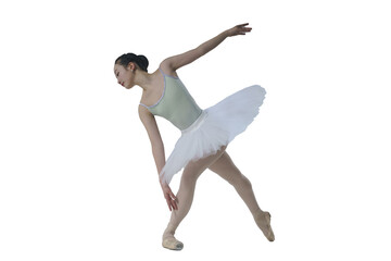 young Japanese ballerina poses in a photo studio with ballet elements showing stretching and...