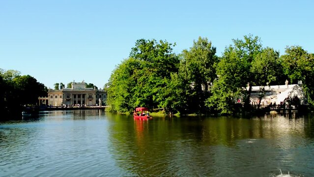 Lazienki Park is largest park in Warsaw, Poland, occupying 76 hectares of city center. Park-and-palace complex lies in Warsaw's central district on Ujazdow Avenue, which is part of Royal.
