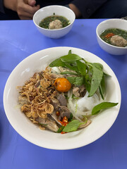 Banh uot long ga, a Vietnamese cuisine. Mixed batter is steamed to become a thin layer, then cut into small pieces. Then mixed them with boiled chicken organs, unlaid eggs. Eat with ginger fish sauce