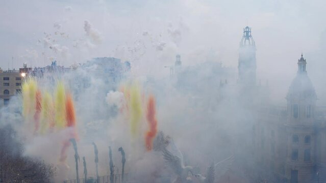 aerial shot of traditional firecrackers festivity at cityhall called fallas, Valencia, Spain