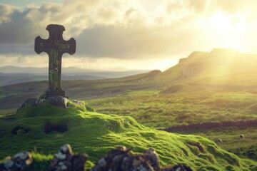 Celtic cross on a green hill with sunshine in the sky. Heavenly light behind ancient symbol of...