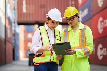 workers or engineers talking about work or project in containers warehouse storage