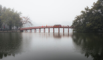 A traditional red bridge in Hanoi, Vietnam