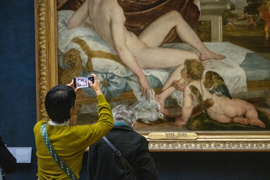 Paris, France, 9 November 2024 : Visitors Photographing Classic Art in Louvre Museum.