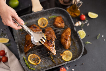 marinated pieces of Organic Tuna Steak frying on a hot grill pan