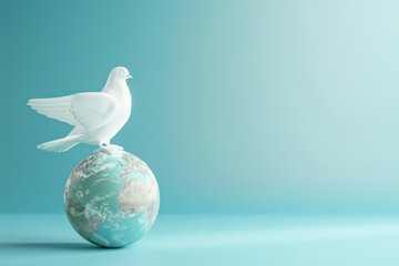 A white dove sits on top of a globe - obrazy, fototapety, plakaty