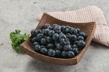 Sweet ripe blueberry on the bowl