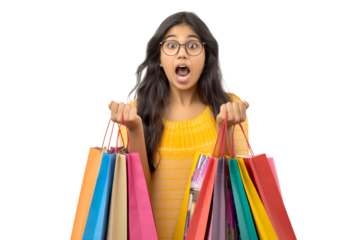 Portrait of excited Indian woman wearing glasses holding shopping bags isolated on transparent background
