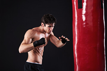 Man, punching bag or workout with fitness, exercise or fighter with progress or wellness with...