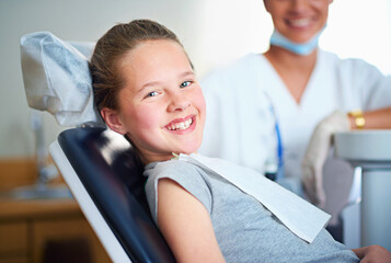 Dentist chair, exam or portrait of girl in consultation room for mouth, gum or wellness. Dental, cleaning or teeth whitening by kid consulting orthodontist for tooth, growth or braces and development
