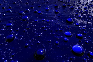 blue oil droplets floating on water surface