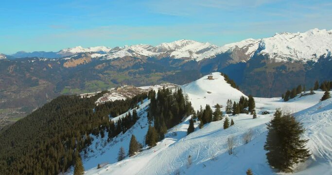 High angle view of snow covered French alps from a chairlift in France. Daytime.