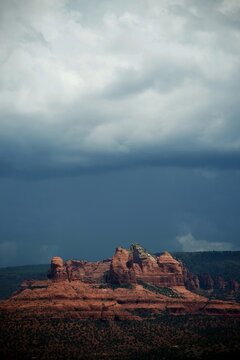 A view of the red bluffs of Sedona with a background storm
