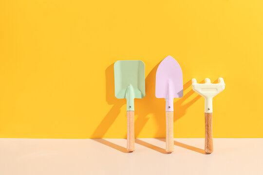 Set of gardening tools on yellow background. spring gardening vibes.