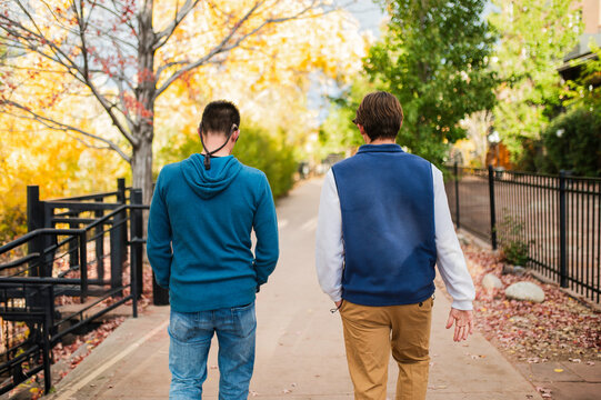 Father and son walking in autumn