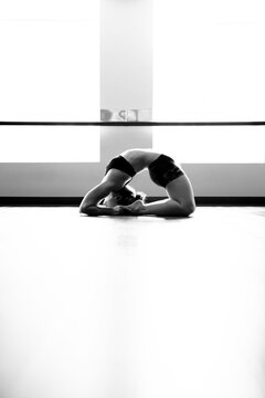 Woman in Back Bend Yoga Pose in Studio