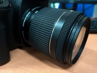Black DSLR camera photo complete with lens, this tool is used by photographers to take pictures