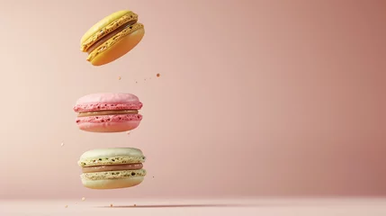 Fotobehang Three macarons falling on pink background © antkevyv