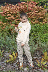 Fashion kid. Cute russian boy, fun child in Moscow city, Russia. Autumn stylish look for child, fashionable little boy. Street style. Fashion kid outdoor. Outfit for child. Kid style