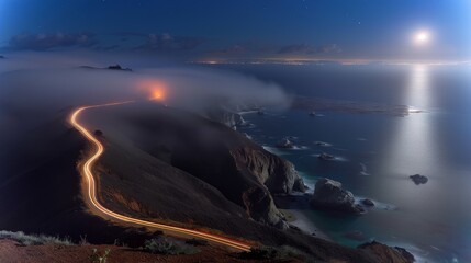 A foggy mountain road with a bright moon in the sky