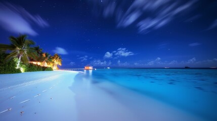 Fototapeta premium beautiful tropical beach at night with long exposure of the sky