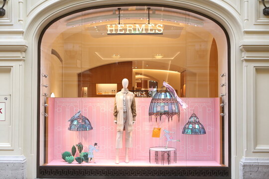 MOSCOW, RUSSIA - NOVEMBER 9, 2020: Creative show window, store display of Hermes boutique shop in GUM department store in Moscow city (State Department Store). Neon art in show windows. Hermes fashion