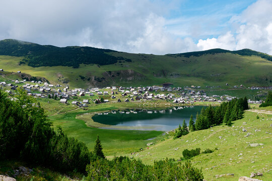 View of Prokosko lake and a village in Bosnia and Herzegovina. Rural life and traditional life. Glacial lake.