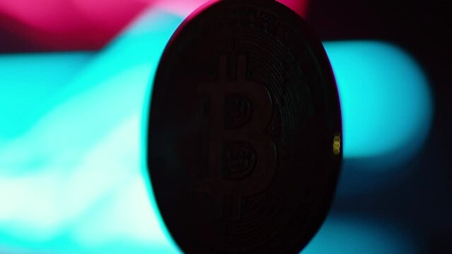 Bitcoin BTC coin and Ethereum ETH coins are rotating with 100 dollars bills. Digital crypto coin and cryptocurrency. Concept of exchange market and online trading. Trading in bull and bear markets