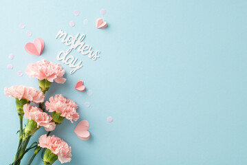 Stylish Mother's Day composition. Top view glance of newly-picked cloves, sweet message, diminutive hearts, and confetti on a pastel blue setting, space for text or publicity - obrazy, fototapety, plakaty