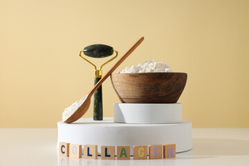 Collagen powder in a wooden bowl with a massage roller