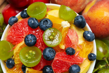 Tasty and healthy nutrition concept - fruit salad