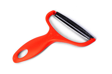 Slicing potatoes. Potato peeler. on a white isolated background. Slicer. Professional vegetable peeler for chefs with a sharp knife or stainless steel blade. Kitchen utensils for the kitchen..