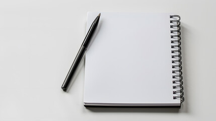 White blank notebook with pen isolated on a white background
