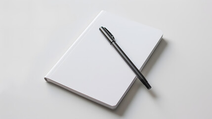 White blank notebook with pen isolated on a white background