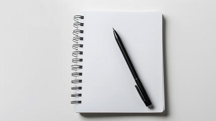 White blank notebook with pen isolated on a white background