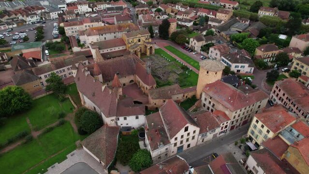 aerial shot around Charlieu Benedictine abbey and Saint Fortunatus priory in Loire department near Roanne, important cluniac site in Auvergne Rhone Alpes region, France