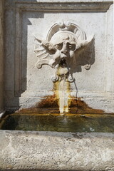 Deatail of the Fountain in Market square in Spoleto, Italy