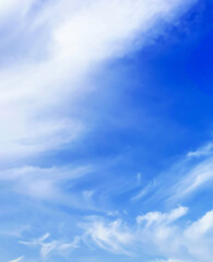 Blue sky with white clouds. Vertical orientation, background