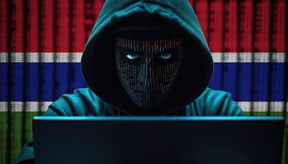 Hacker in hoodie sitting in front of a monitors with Gambia flag background and  cyber security concept - obrazy, fototapety, plakaty