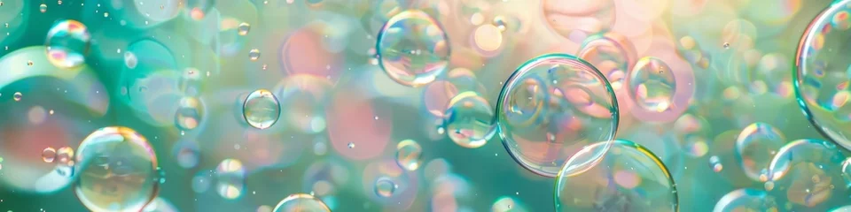 Fotobehang Multiple translucent soap bubbles floating in the air with a green and pink backdrop, background, wallpaper, banner © keystoker